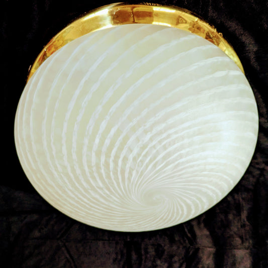 An Italian white Murano glass Domed Ceiling Light With Brass Gallery on a black bacgkround