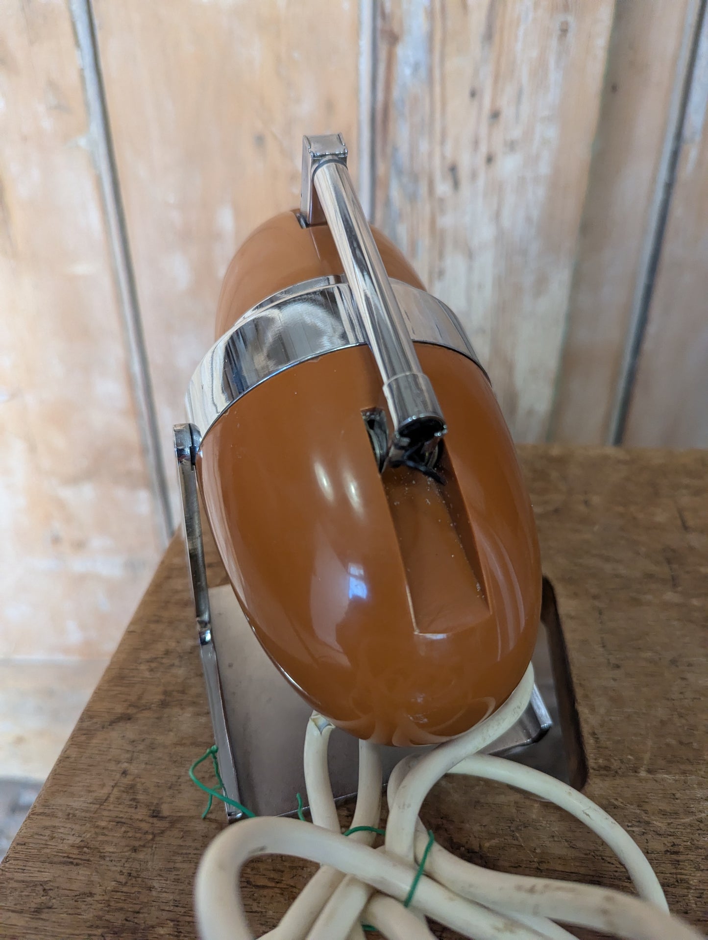 a brown Hamilton Industries Model 60 1957 Desk Lamp on a wooden background