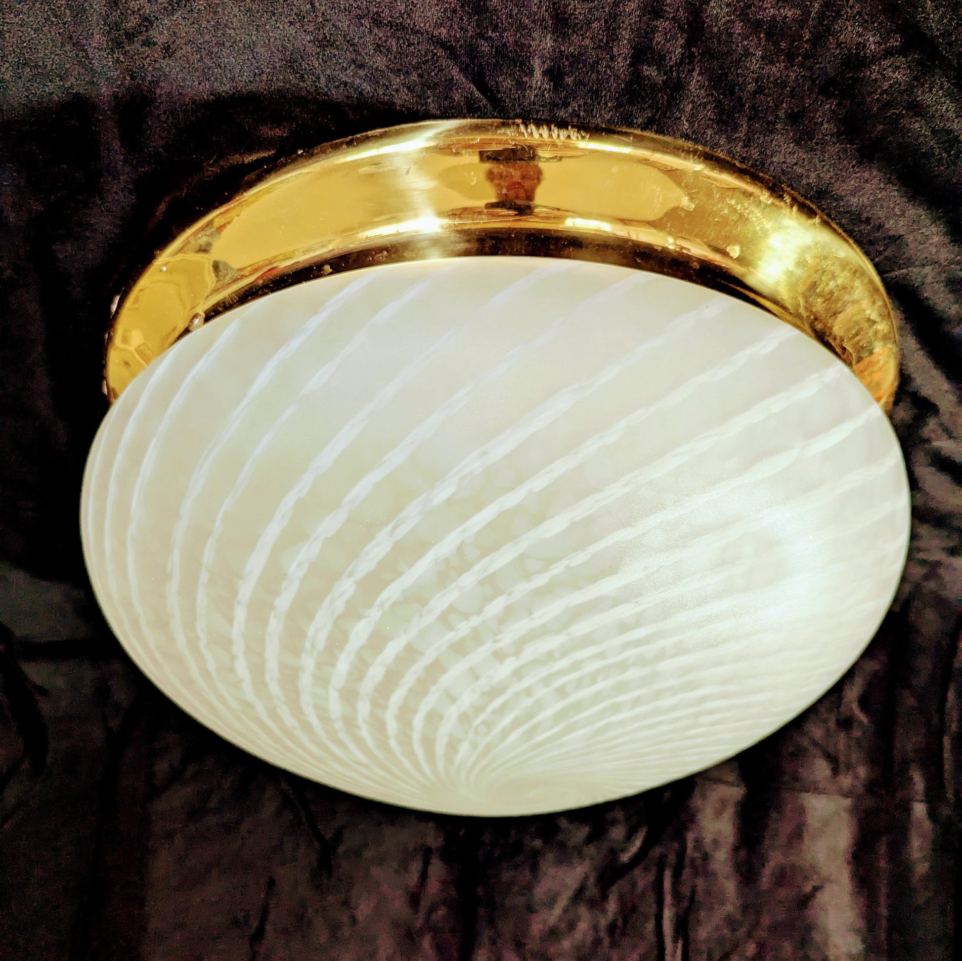 An Italian white Murano glass  Domed Ceiling Light  With Brass Gallery on a black bacgkround