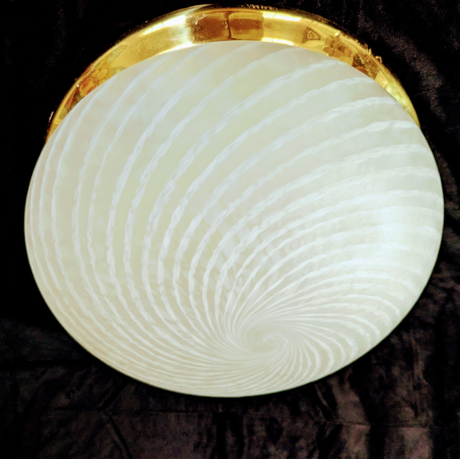 An Italian white Murano glass  Domed Ceiling Light  With Brass Gallery on a black bacgkround