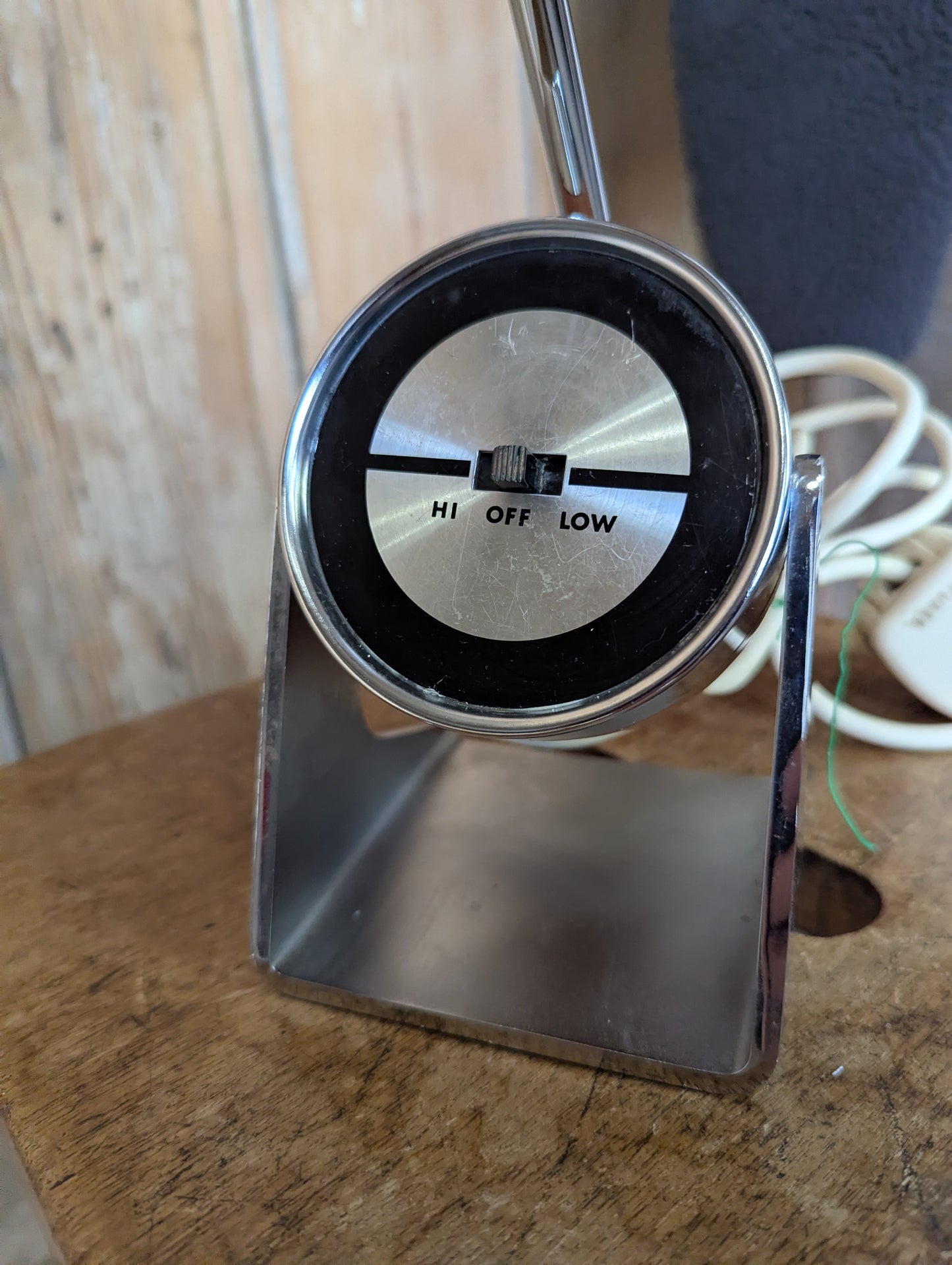 a brown Hamilton Industries Model 60 1957 Desk Lamp on a wooden background