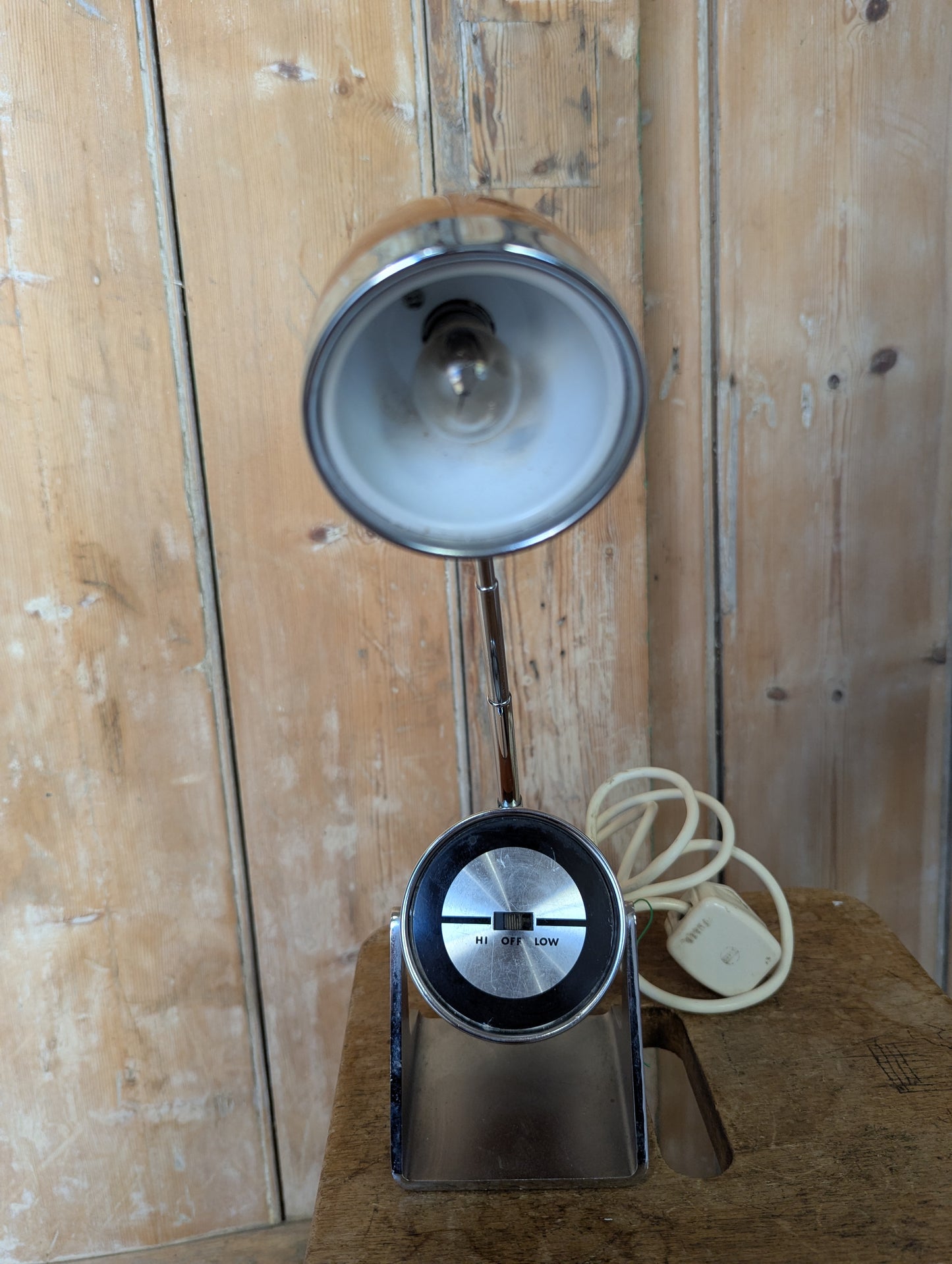 a brown Hamilton Industries Model 60 1957 Desk Lamp on a wooden background