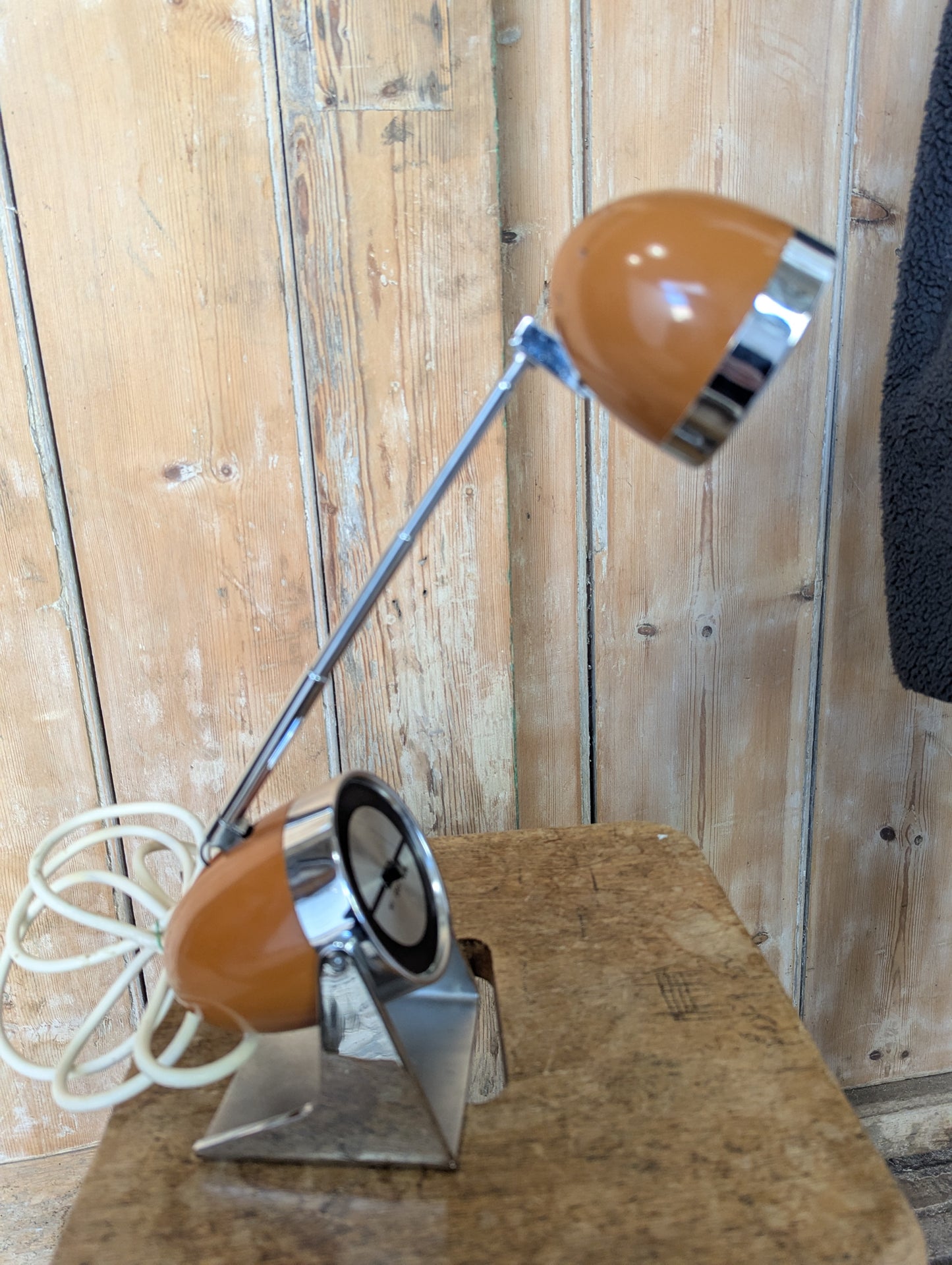 a brown Hamilton Industries Model 60 1957 Desk Lamp on a wooden background