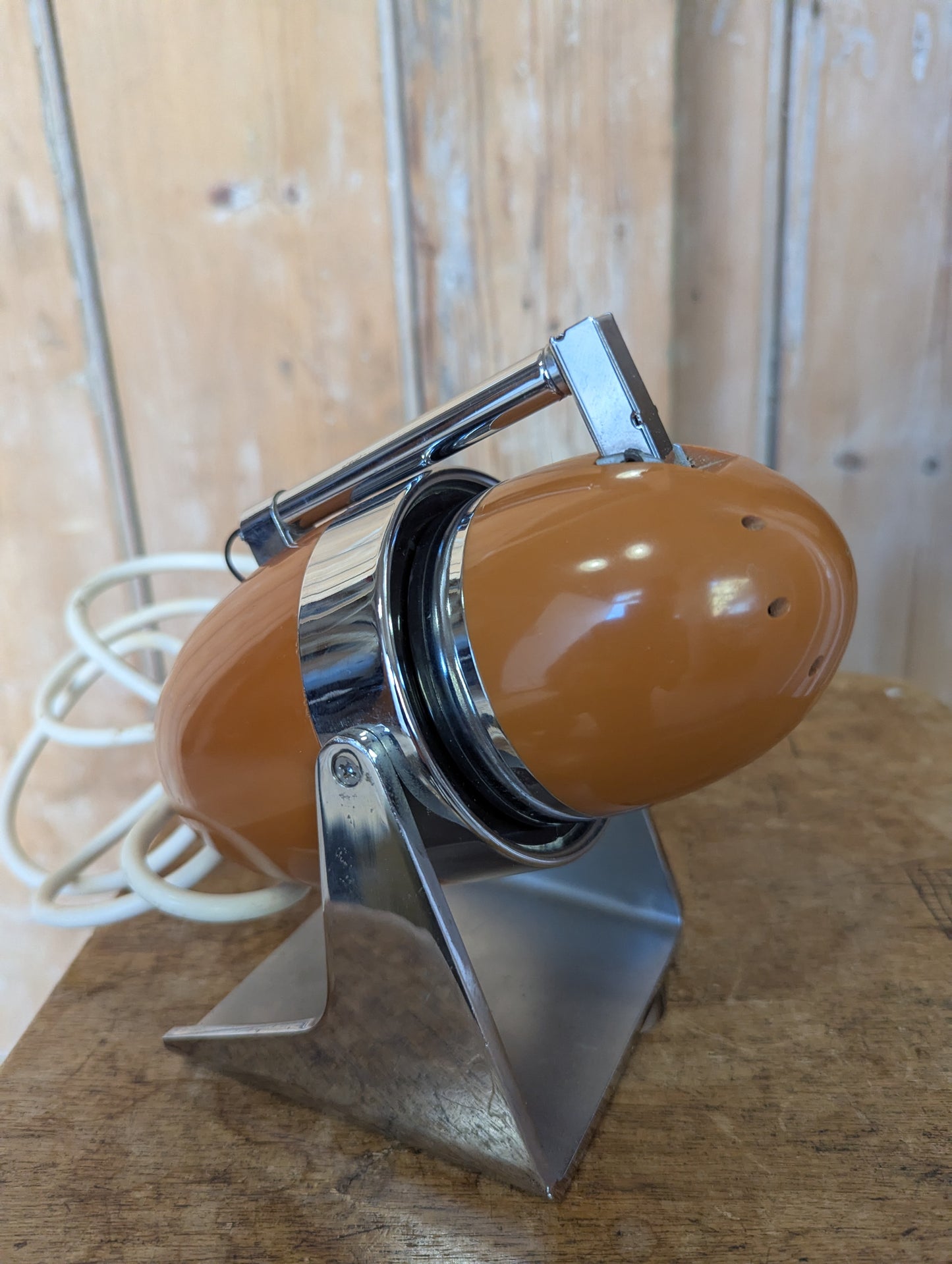 a brown Hamilton Industries Model 60 1957 Desk Lamp on a wooden background