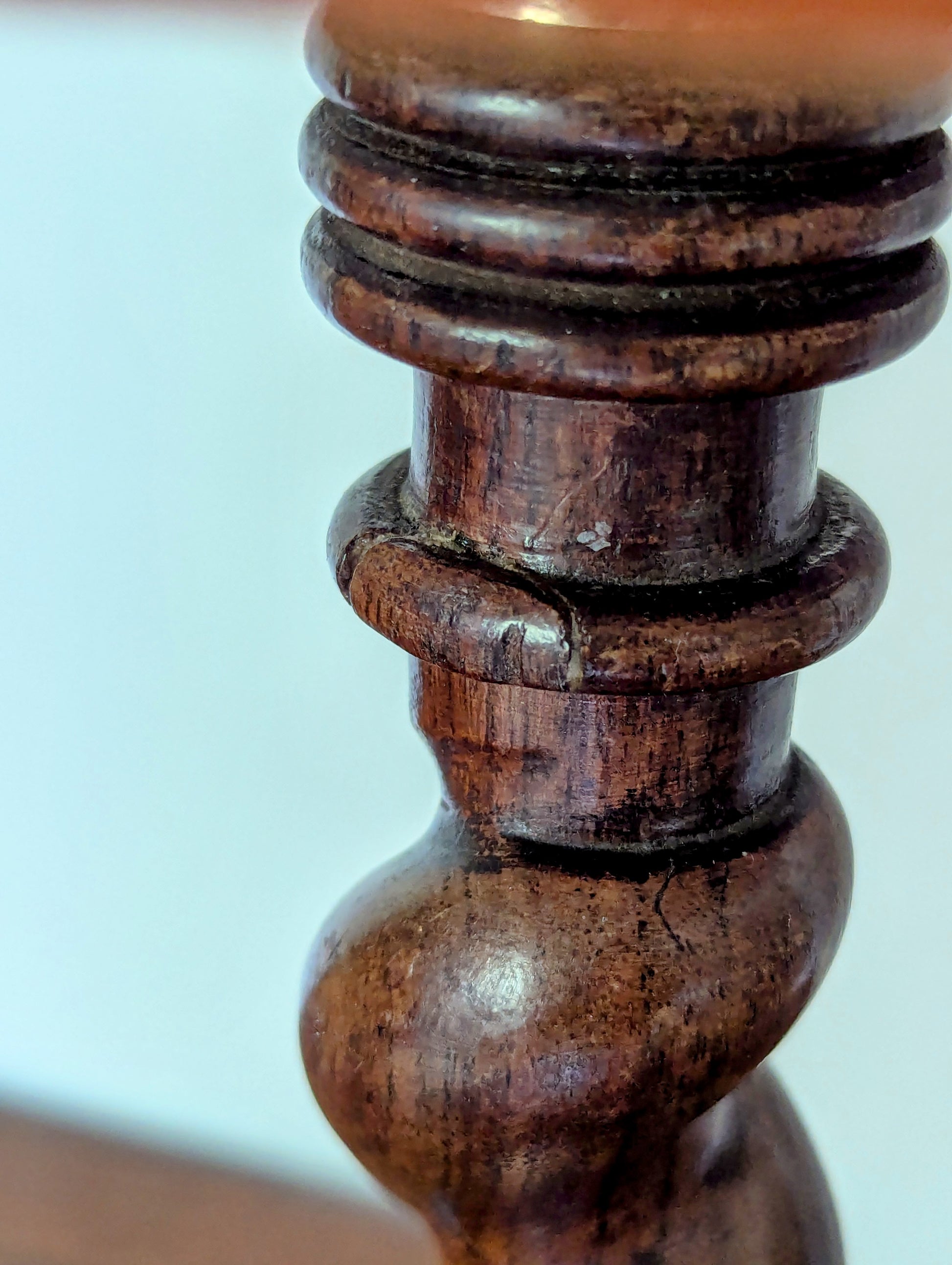 Close-up of a wooden spindle with a blurred background